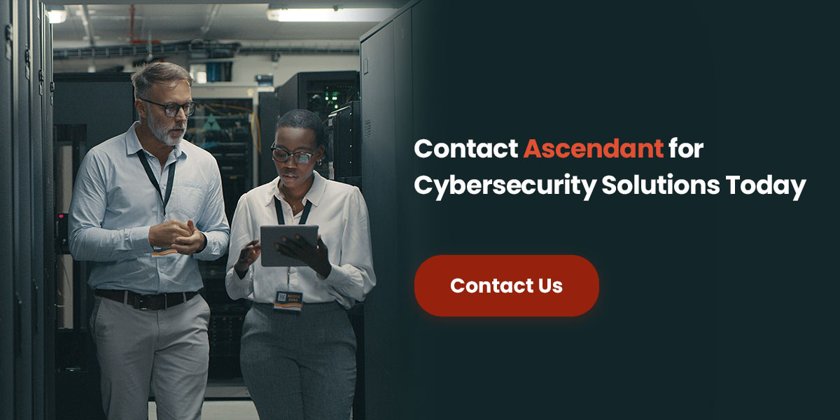 IT professionals with a tablet and the words "Contact Ascendant for Cybersecurity Solutions Today"
